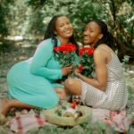 a couple of women sitting next to each other